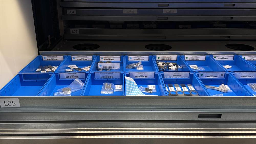 Warehouse spare parts organized with a visual color-point identification system